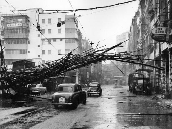 1964 Scaffolding brought down by 'Typhoon Ruby' is caught by overhead tram power lines on Des Voeux Road West