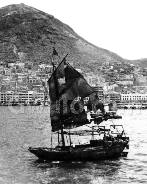 c.1955 Sailing junk in harbour off Sheung Wan