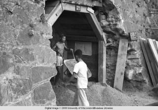 Hong Kong, men working in an air raid shelter