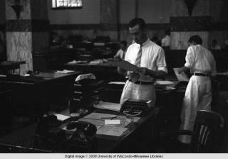 Hong Kong, men working in an office