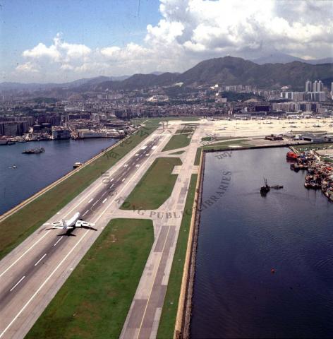 1990 The single runway at Kai Tak International Airport, seen from the east