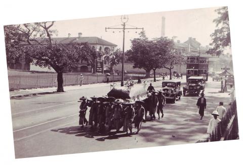 1930s Funeral procession passing cricket pitch