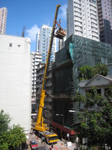 Dropping in an excavator to demolish an old building