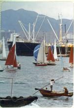 Boats racing in the crowded Hong Kong Harbor