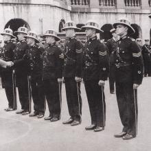 Sir Geoffry Northcote presenting medals to police officers at the Central Police Station 