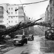 1964 Scaffolding brought down by 'Typhoon Ruby' is caught by overhead tram power lines on Des Voeux Road West