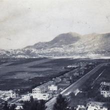 "View of camp with Kawloon City in the background"