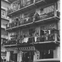 Laundry Day in Kowloon Over Paint Spraying Company, circa 1964
