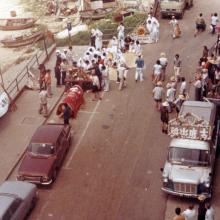 Street funeral, looking down from Sea and Sky court, Stanley Main street, squatter area in back levels-crop