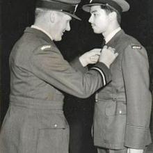 Plt Off Gordon Randall receives his Wings from Air Cdre S E Faber