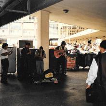 Andean musicians by ferry entrance