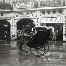 Five rickshaws in rain.