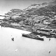 Holt's Wharf-liberation aircraft carrier moored-1945