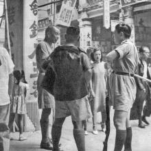 Hong-Kong-street-scene-guard with shot-gun-October-1949