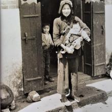 Chinese peasant woman holding a child in the New Territories