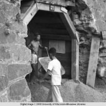 Hong Kong, men working in an air raid shelter
