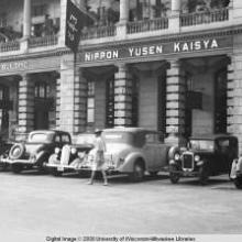 Hong Kong, cars parked in front of a building