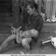Hong Kong, woman with baby on street